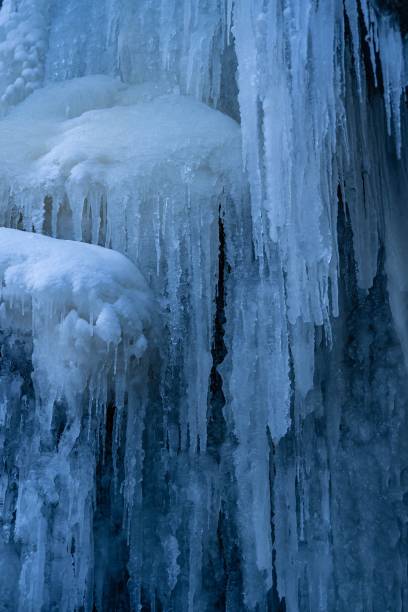 istock Vertical shot of frozen waterfall 1447860874