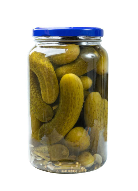 istock Pickled Cucumbers in Glass Jar Isolated, Fermented, Marinated Vegetables, Gherkins 1447864395