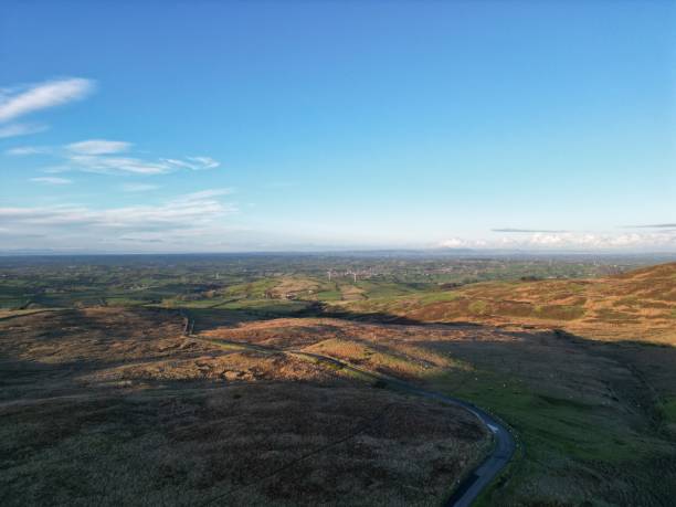 istock Aerial of a landscape under a blue sky with clouds. 1447864499