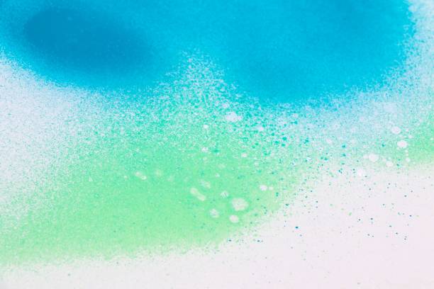 istock Blue and green color sprayed over a white background 1447864599
