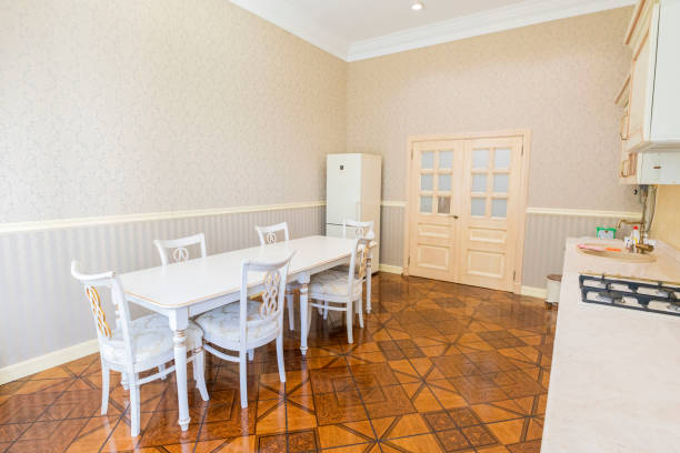 istock Large bright kitchen with high ceiling and linoleum flooring on the floor 1447866376