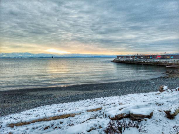 istock Snowy shore under blue cloudy sunset sky 1447866447