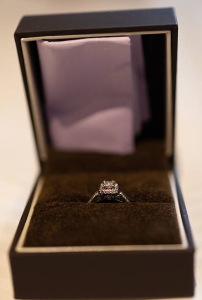 istock Closeup of a wedding ring with a diamond stone in a black box 1447867037