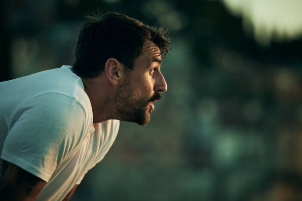 istock Young male athlete taking a break from sports training. 1447867070