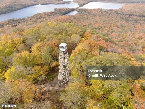 Aerial Of Kane Mountain Fire Tower With Autumn Forest Scape Water Near Fulton County New York Stock Photo - Download Image Now