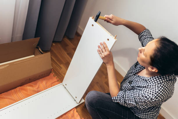 istock Woman assembling furniture 1447870197