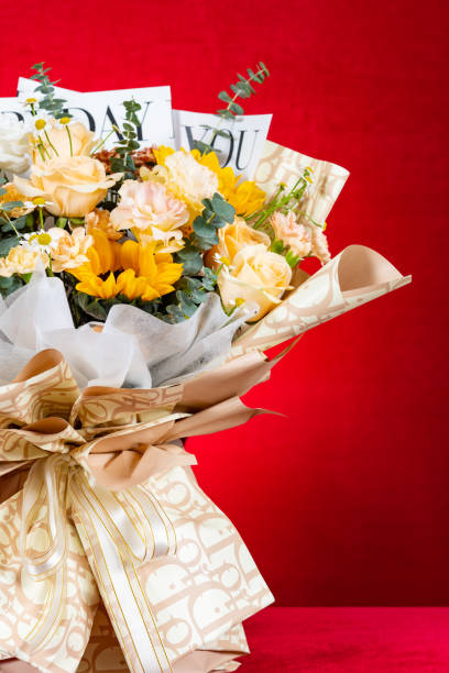istock bunch of beautiful flowers as gife on red at vertical composition with copy space 1447874026