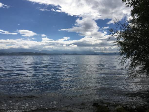 istock Erhai blue sky white clouds calm water 1447874954