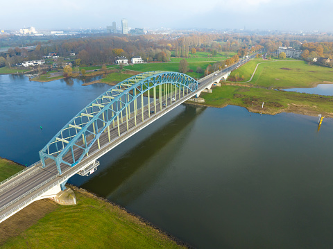 IJsselbrug or Katerveerbrug bridge over the river IJssel near the city of Zwolle in Overijssel, The Netherlands. Aerial drone point of view.