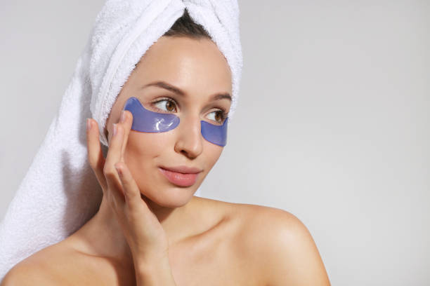 istock Female model with under eye patches. 1447877469