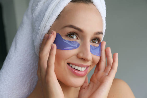 Female model with under eye patches.