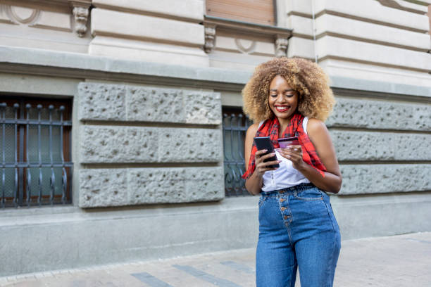 istock Woman laughing when shopping online 1447879397