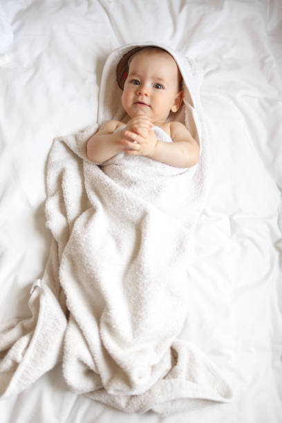 istock Baby wearing towel after bath 1447880855