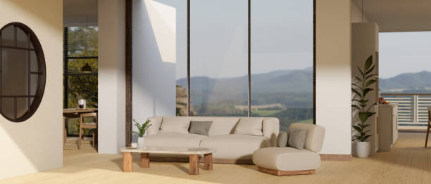 istock Cozy and comfortable spacious living room with white sofa, large glass window with mountain view 1447884280