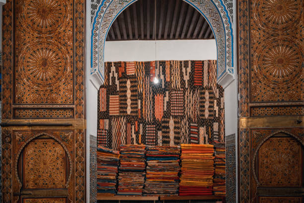 Assorted Moroccan handmade rugs carpet display for sale at souk, Fez, Morocco