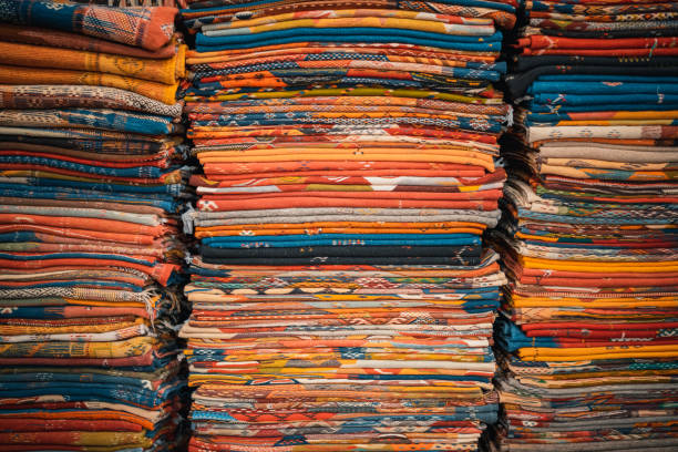 istock Assorted Moroccan handmade rugs carpet display for sale at souk, Fez, Morocco 1447885228