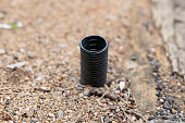 Black Plastic tubing coming from the ground.
