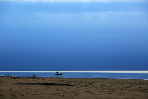 The fishman in the Rigas bay , Saulkrasti beach in Latvia