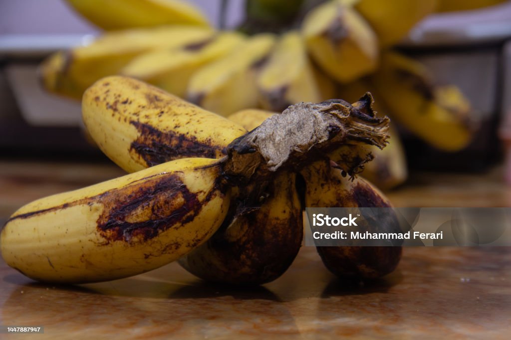 Banana healthy food View of banana in a metallic table with blurry background of some banana 1980-1989 Stock Photo