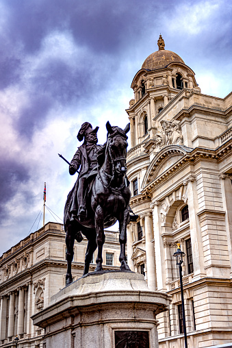 Charles I Statue at Trafalgar Square in Whitehall, London, with commercial buildings visible.
