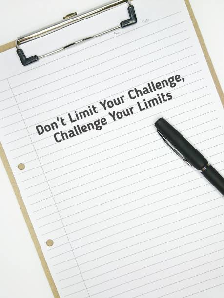 istock Motivational quote written with phrase DON'T LIMIT YOUR CHALLENGES, CHALLENGE YOUR LIMITS. 1447888415