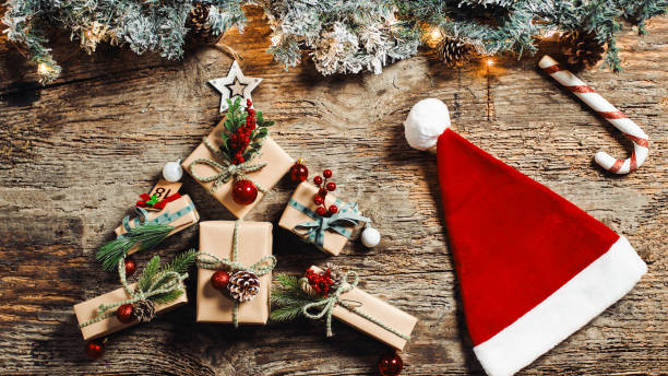 istock Christmas background with presents and a red hat 1447888514