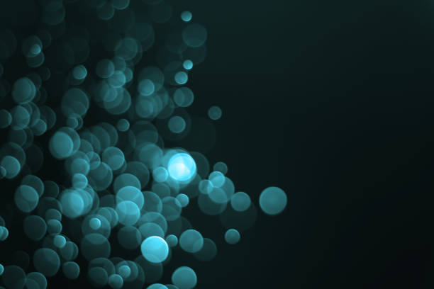 istock Blue-green bokeh background, blurred background beautiful glow 1447888559