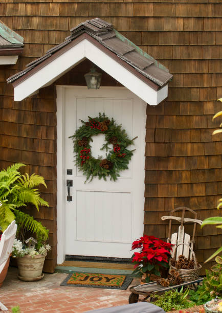 istock Front door entry through the turret wrapped in cedar shingles 1447891333