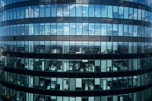 Modern office high rise building facade. Cityscape panorama with business center glass facade