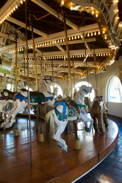 Dancing ponies spinning around on the carousel