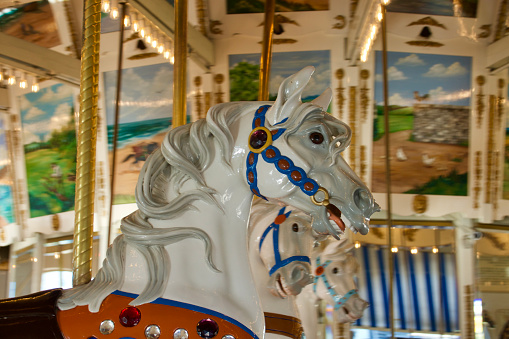 Vintage carousel with a row of horses