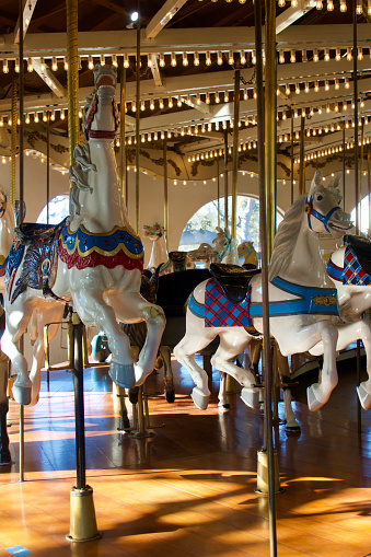 Charging horses on the vintage carousel