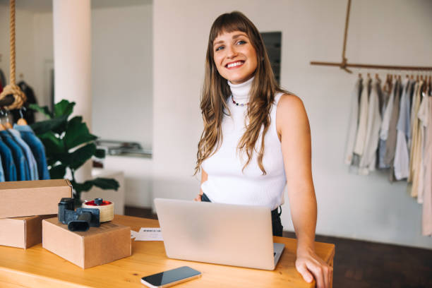 istock Online store owner looking away thoughtfully in her shop 1447893433