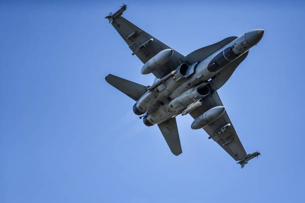 istock Military supersonic fighter jet with blue sky in the background 1447895885