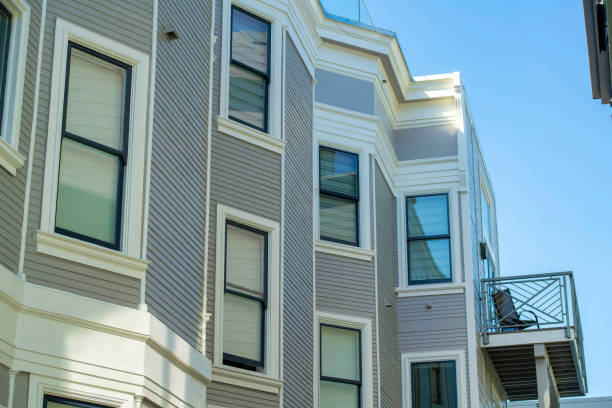 istock Building facade with wooden pannels and white accent paint around visible winows with clear blue sky background in late day shade 1447897446