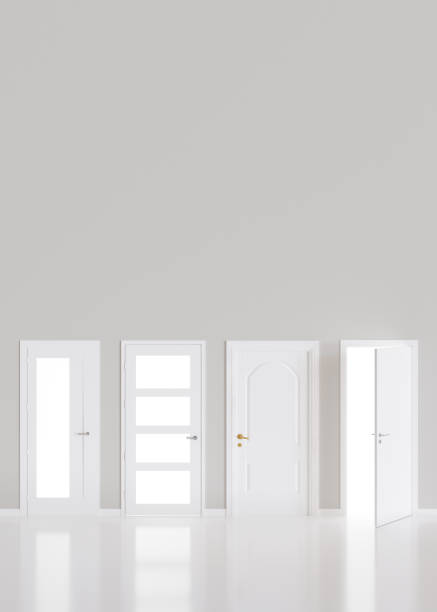 istock Modern white doors in empty room. Copy space for text, advertising. Production and trade of interior doors. Stylish internal door. Manufacture and sale. Vertical layout. 3D rendering. 1447897882