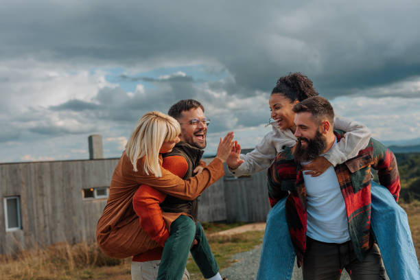 istock Playful couples outdoors. 1447899420