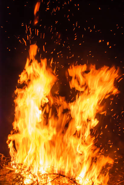 istock Abstract blaze fire flame texture for banner background. Fire sparks particles with flames isolated on black background. Beautiful flames. Fuel, power and energy 1447900549