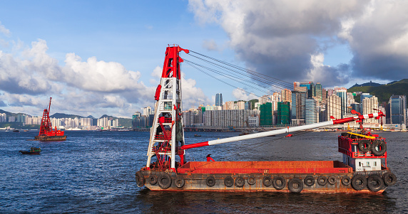 Floating cranes sails the Hong Kong bay