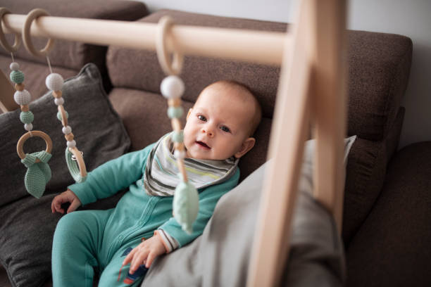 istock Cute baby playing with wooden toy. 1447902870