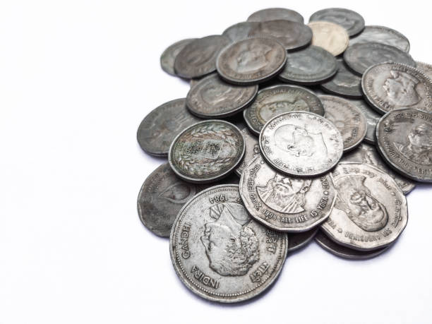 istock Old silver coins isolated on white background 1447905380