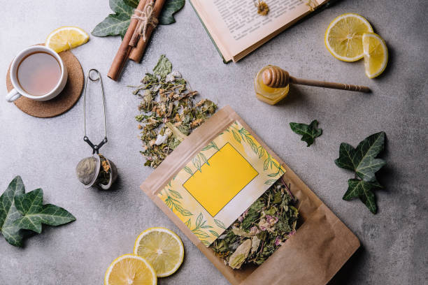 istock cup of tea with lemon slices and tea packaging 1447905655