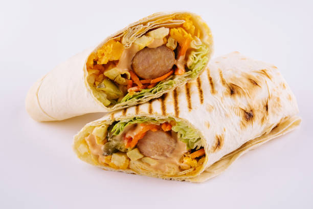 spicy sausages in pita bread isolated on white spicy sausages in pita bread isolated on white shawarma stock pictures, royalty-free photos & images