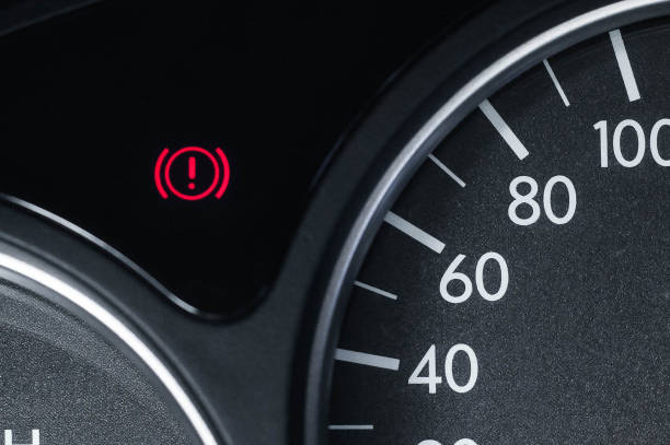Car tachometer illuminated at dusk, used to indicate the engine speed to the driver