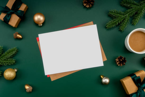 istock Home office table with Christmas decorations, coffee cup, keyboard, paper notebook. Christmas workspace. 1447906252