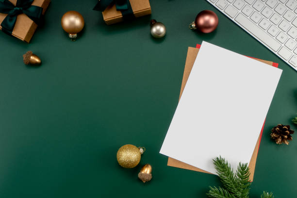 istock Home office table with Christmas decorations, keyboard, paper notebook. Christmas workspace. 1447906264