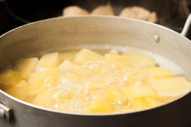 istock Bringing to readiness boiled potatoes diced. Aluminum pan. 1447907411