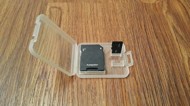 istock Memory card or Micro Sd card and adapter with case on wooden background 1447907800