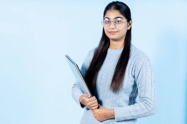 istock young indian girl with laptop 1447909293
