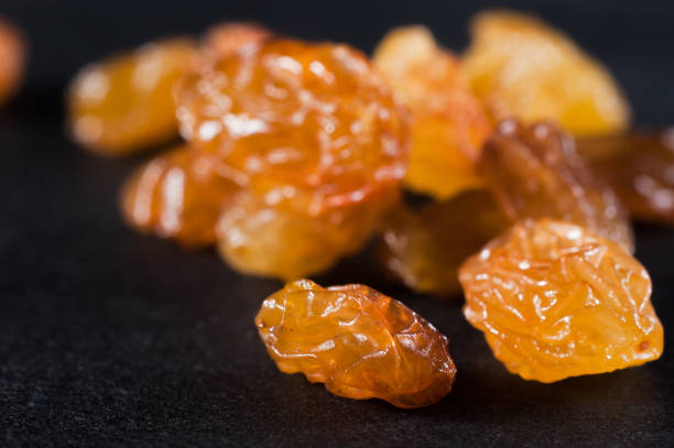 istock Raisins on a dark background close-up, macro. 1447909579